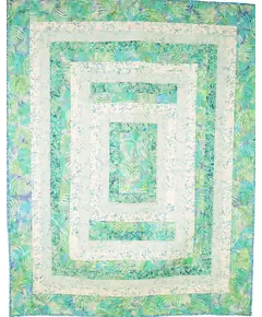 Seeing Double Reversible Throw Quilts Bag Pattern by Aunties Two - completed quilt in green and white
