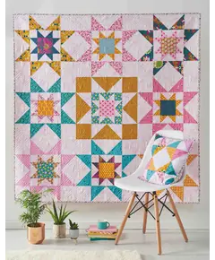 Galaxy Twist Quilt Pattern by Tied With A Ribbon - Completed quilt and pillow on display