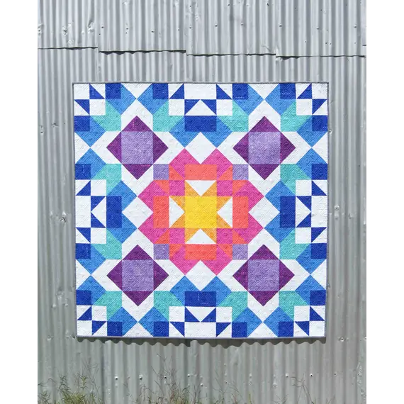 Aurora Quilt Pattern by Tied With A Ribbon - Quilt hung on corregated iron for effect